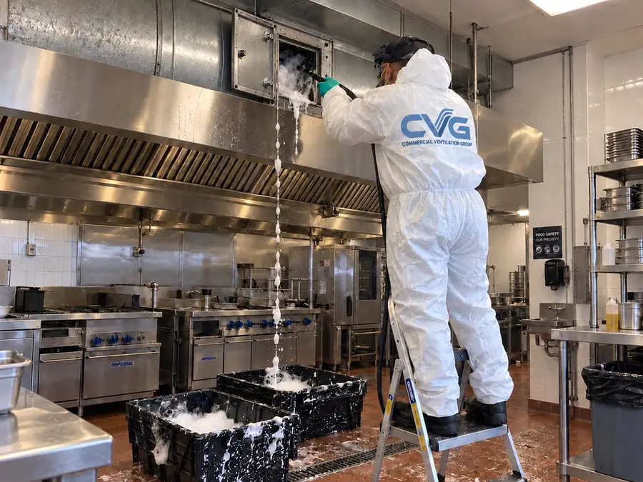 CVG technician cleaning a commercial kitchen extraction system